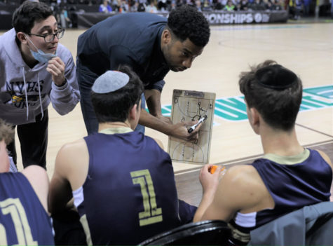 TIMEOUT––Coaches Ashford Jackson and Josiah Cohen (Right to Left) draw a play for captains Victor Maimon and Yoel Kintzer at the State Tournament in Spokane.