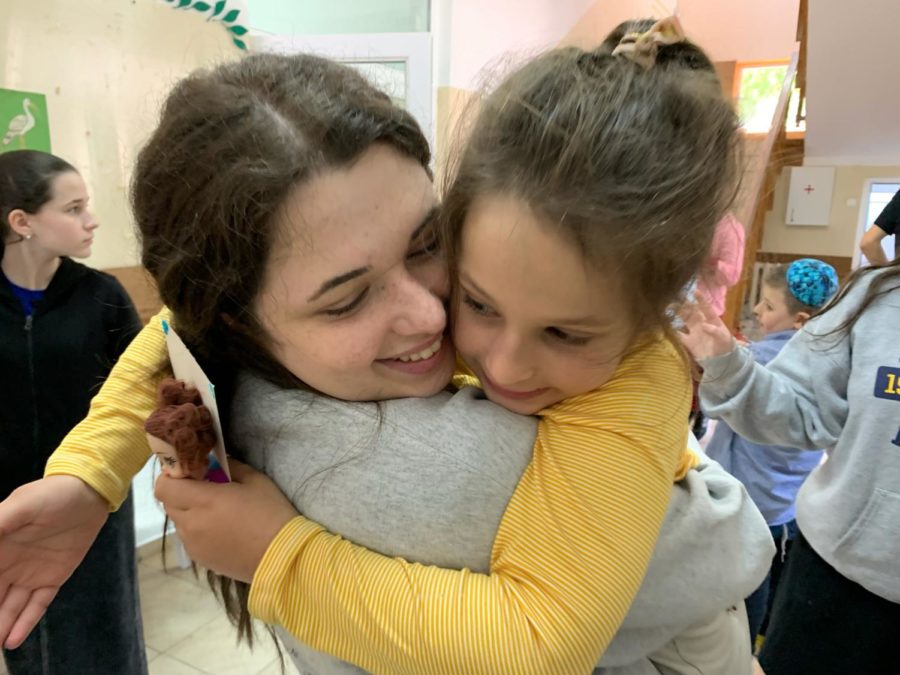Anna Benoliel smiles at school with a child from Tikva Childrens Home