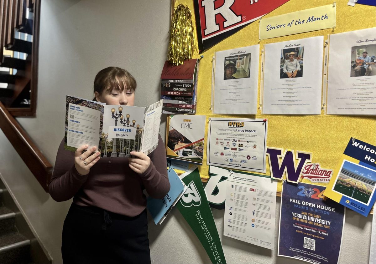 Ariana Balkany reviews college options at the senior bulletin board