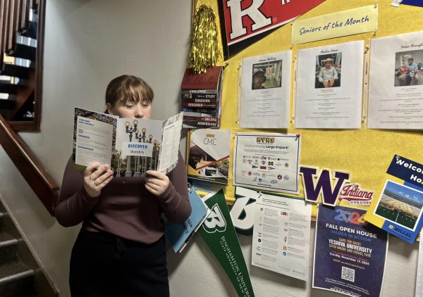 Ariana Balkany reviews college options at the senior bulletin board